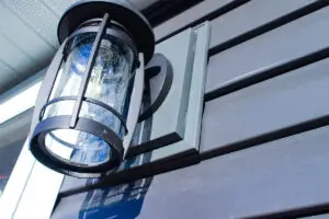 Electrical mounting block around exterior porch light at the Osland home, installed by All Craft Exteriors in Grand Meadow, Minnesota.