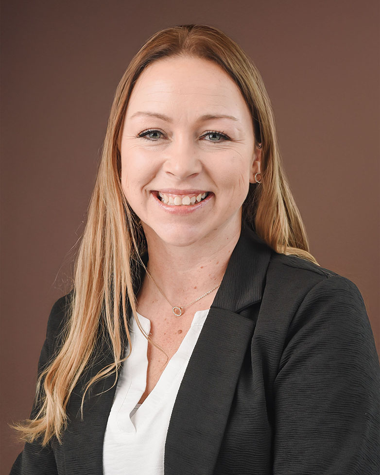 Portrait of Jewels DeCorsey, General Manager of All Craft Exteriors, a home improvement company in Rochester, Minnesota.