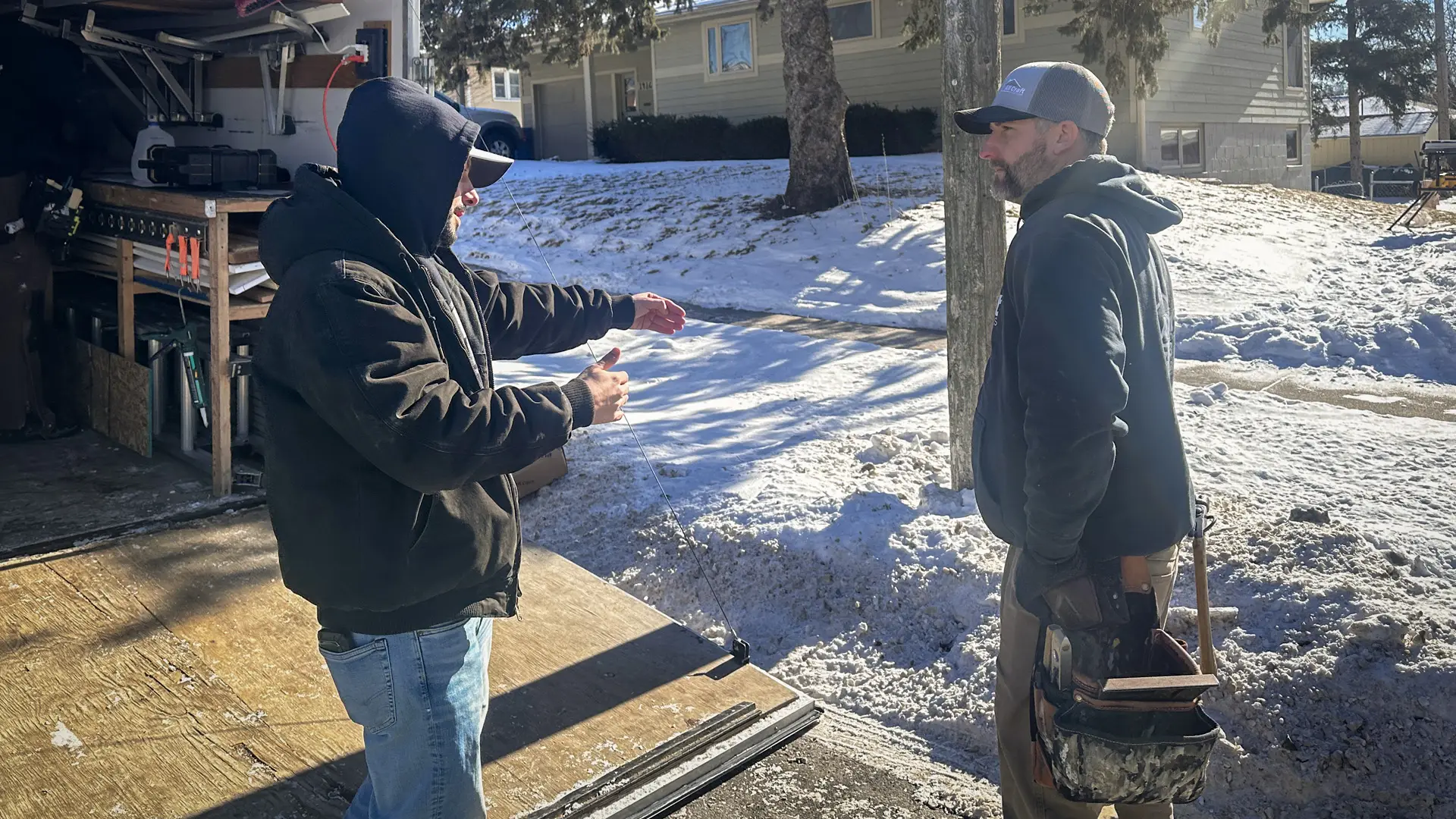 All Craft Exteriors Crew members discuss an in progress job