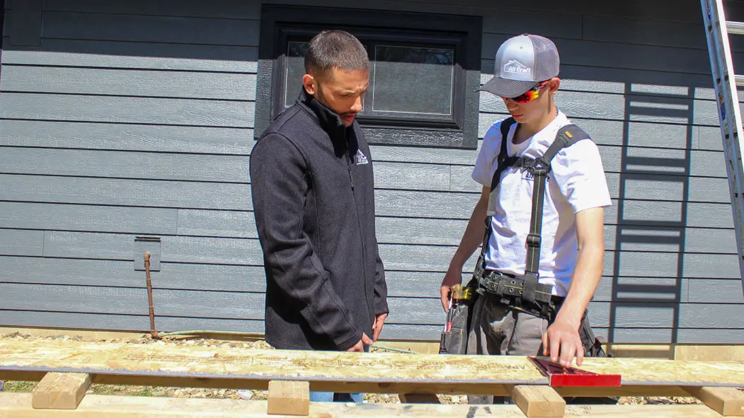 Matt Peterson of All Craft Exteriors on the jobsite with coworker