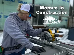 Micayla using a circular saw on a siding project during Women in Construction Week at All Craft Exteriors